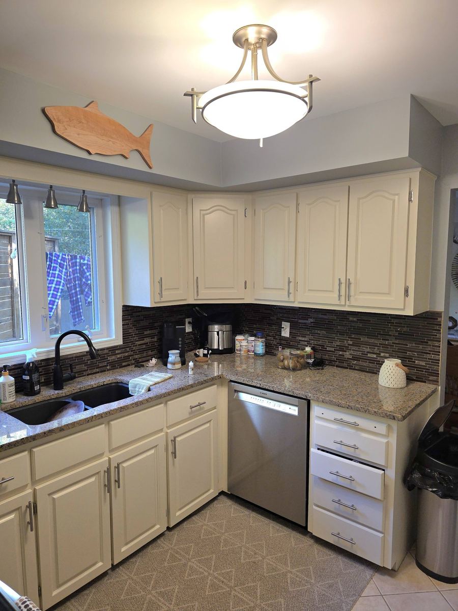 After: Kitchen with bright white cabinets
